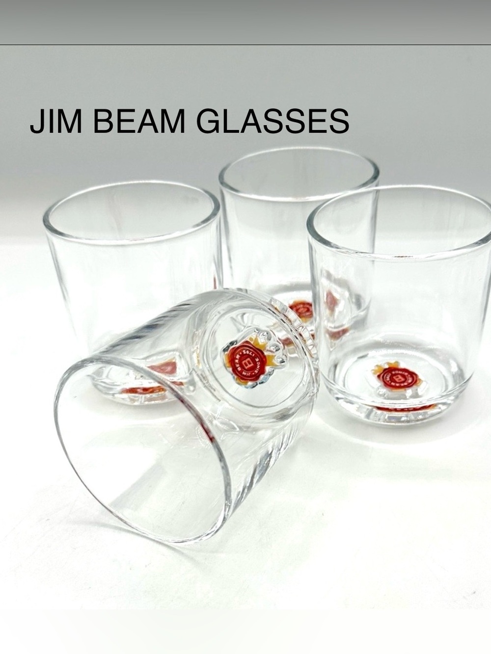 4 Jim Beam Whiskey Glasses, with emblem embedded in the bottom of the glass.